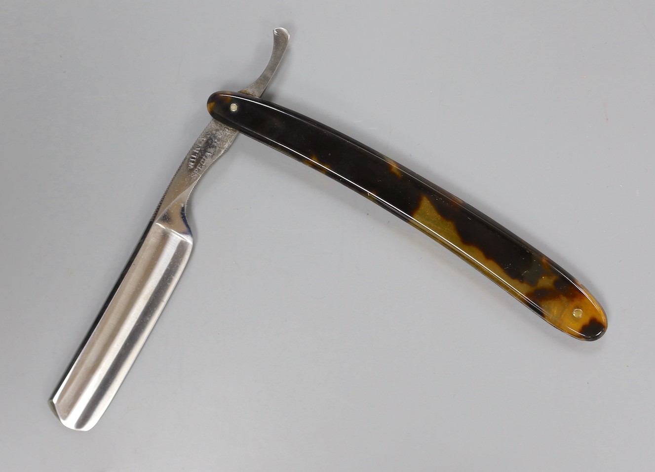 A set of seven tortoiseshell handled cut throat razors for the days of the week Wilkinson and a cased pair of tortoiseshell handled razors, C&W Higginbottom